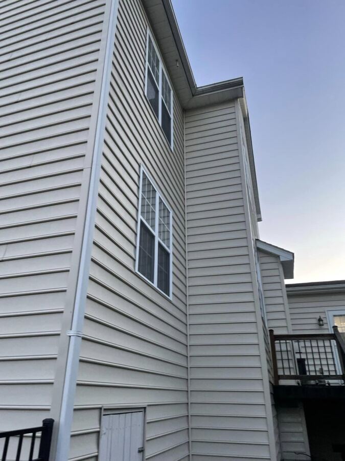Green algae on a two-story corner, washed, after