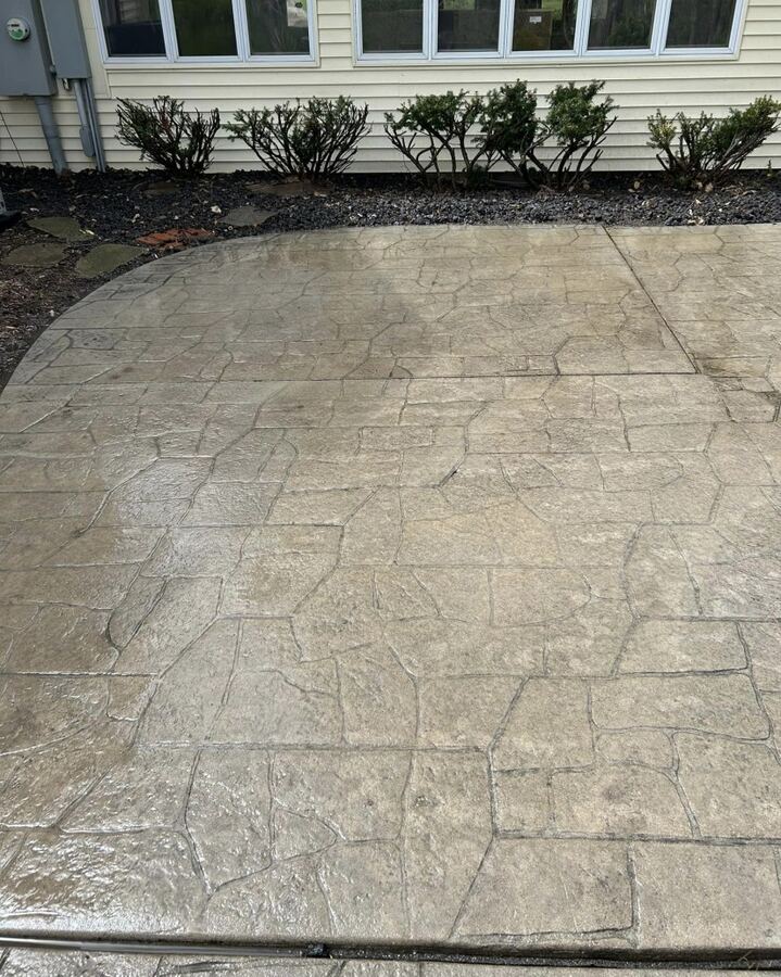Stamped concrete patio: moss and grime removed, after