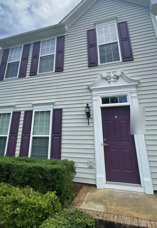 Two-story house wash: algae streaks gone from the siding, after