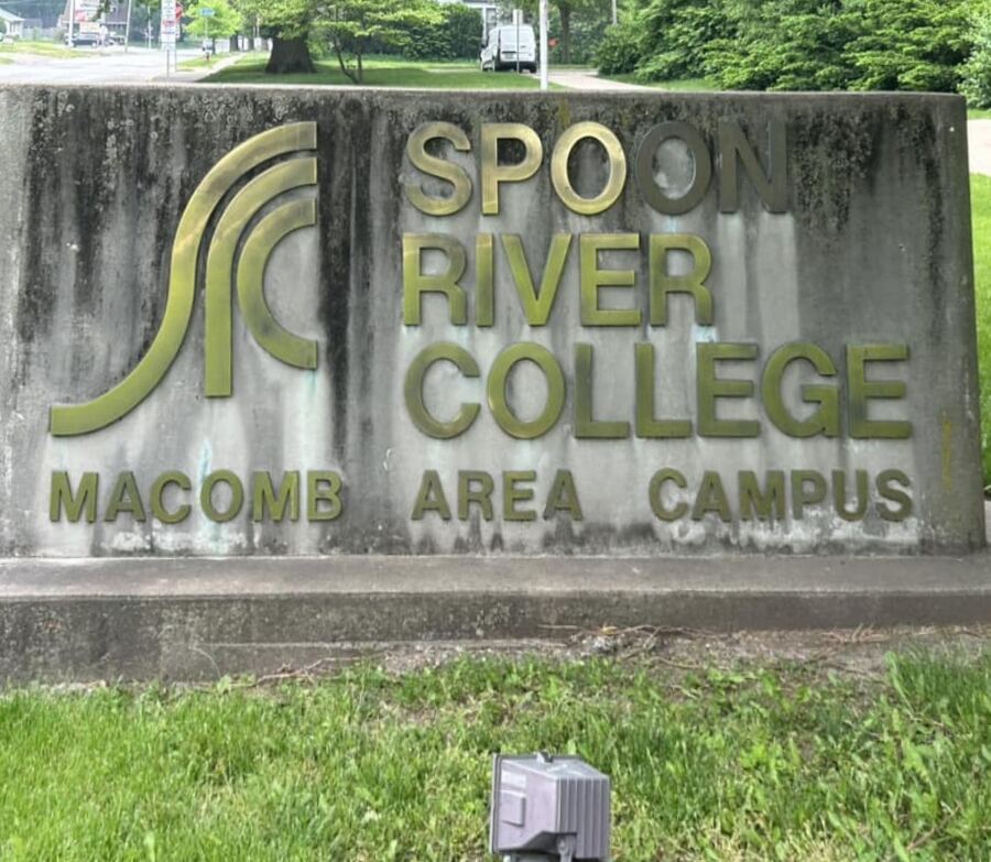 Spoon River College sign, Macomb: black streaks removed, before