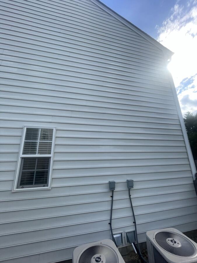 White vinyl siding: mildew spots removed, after