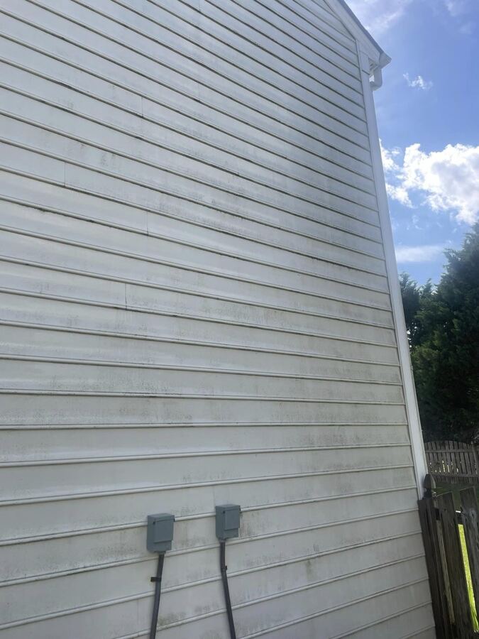 White vinyl siding: mildew spots removed, before