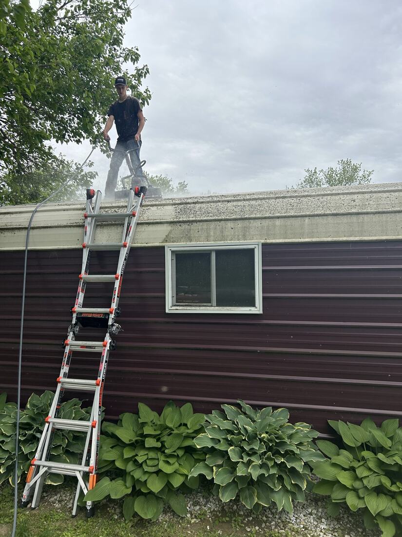 Cleaning a low-slope roof