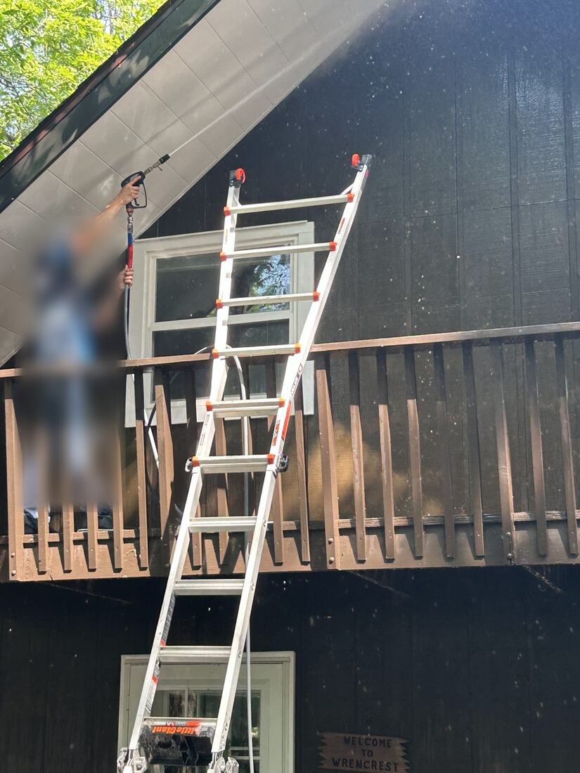 Washing dark siding and a second-story deck